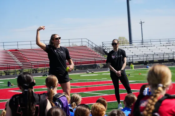 A coach mentoring a young player