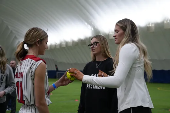 A coach demonstrating for an athlete