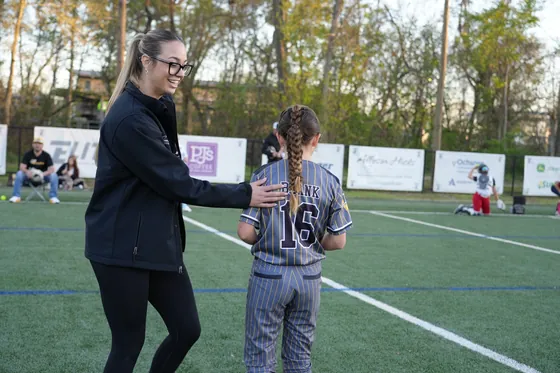 A coach working with a pitcher