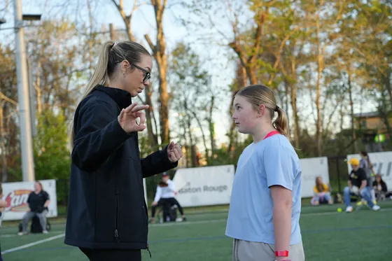 A coach mentoring an athlete