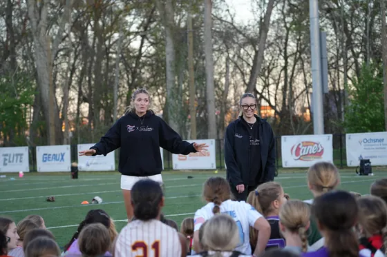 A coach demonstrating for a player