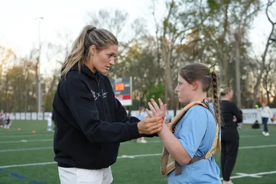 A coach working with an athlete outside
