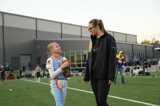 Montana Fouts with a young pitcher